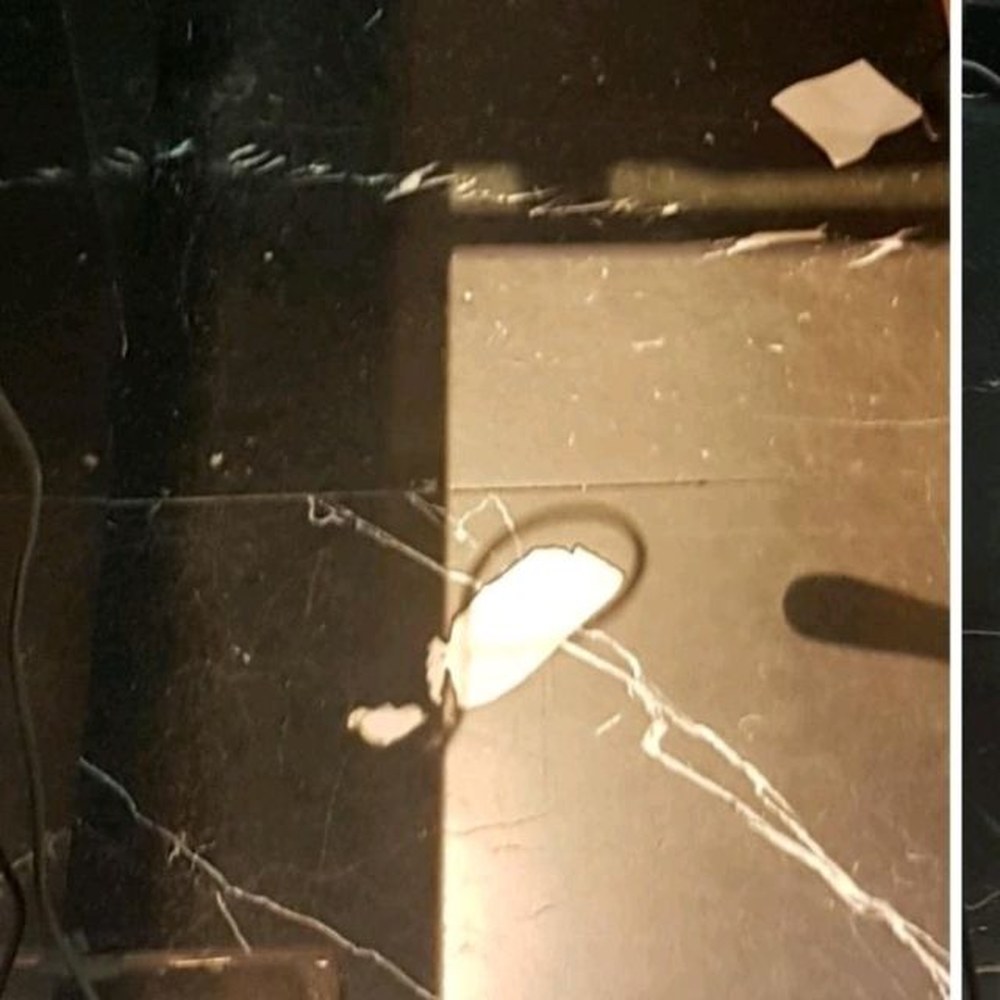 Black floor tile repair — before